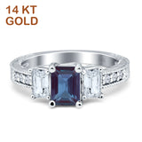 Three Stone Emerald Cut Gold Ring