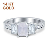 Three Stone Emerald Cut Gold Ring